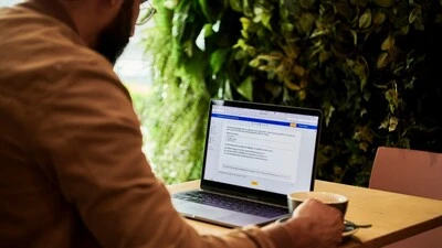 Man using Microsoft Word on Laptop